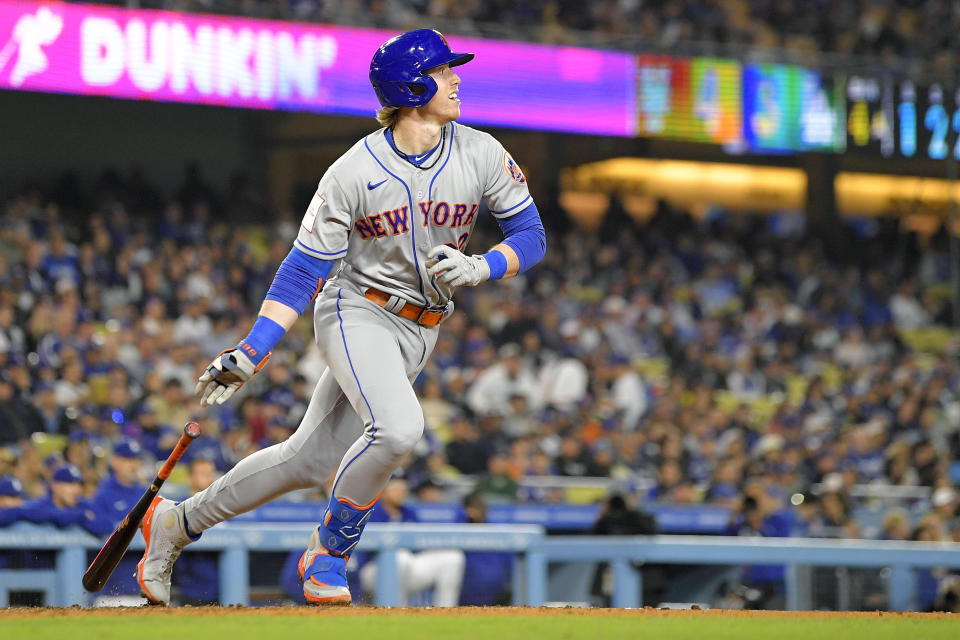 New York Mets' Brett Baty, second from left, heads to first as he hits an RBI single during the fourth inning of a baseball game against the Los Angeles Dodgers Monday, April 17, 2023, in Los Angeles. (AP Photo/Mark J. Terrill)
