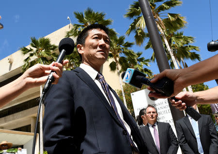 Hawaii Attorney General Douglas Chin talks to the media at the U.S. District Court Ninth Circuit after seeking an extension after filing an amended lawsuit against President Donald Trump's new travel ban in Honolulu, Hawaii, March 29, 2017. REUTERS/Hugh Gentry