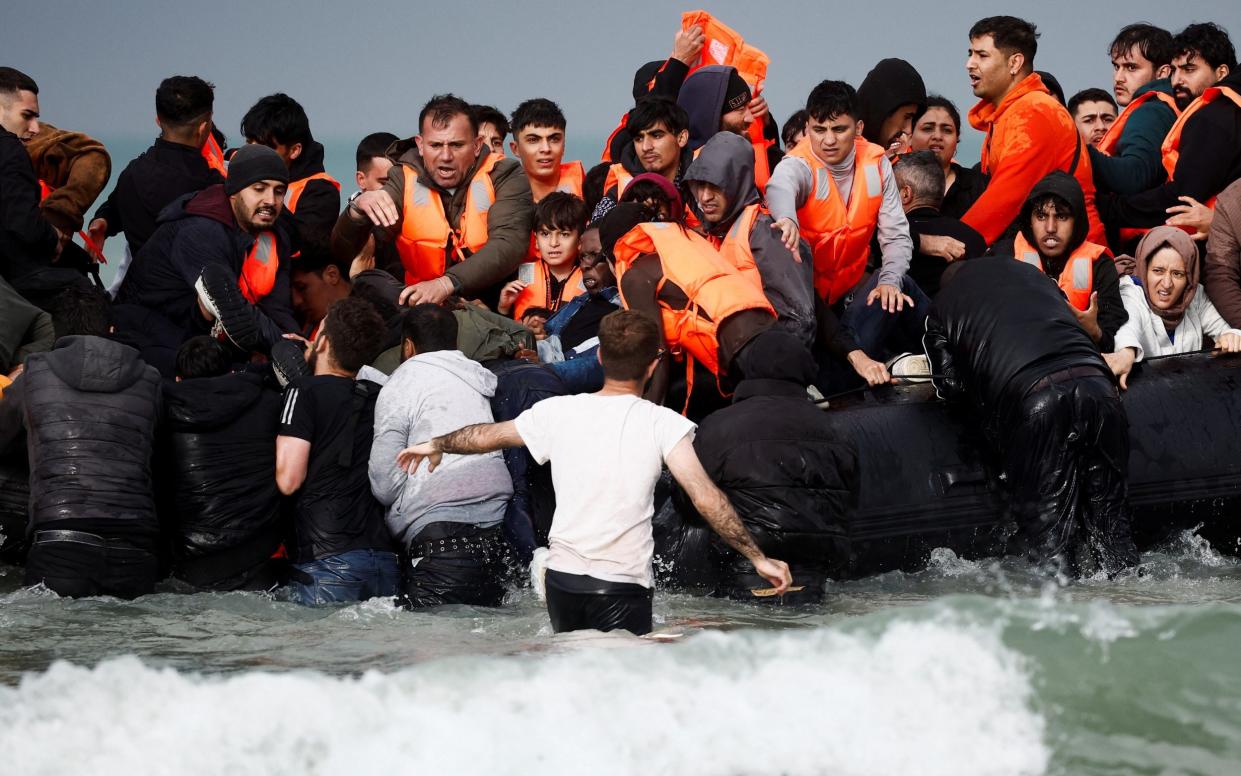 Migrants crossing the channel on Wednesday on a packed dinghy