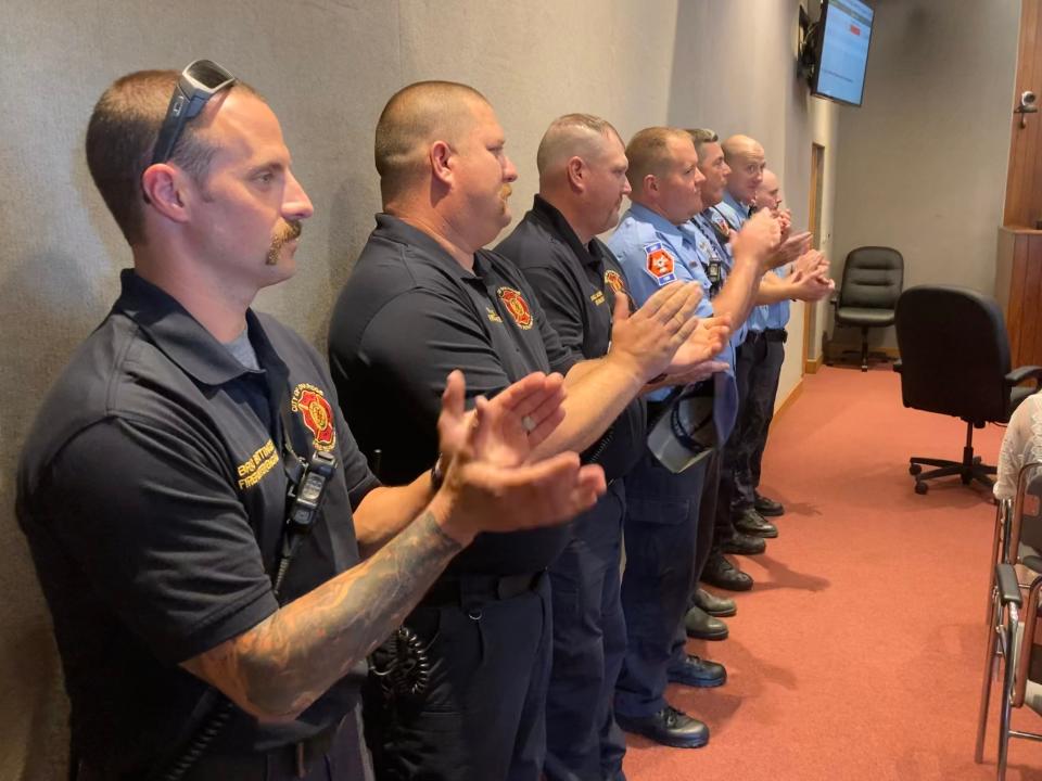 Oak Ridge firefighters applaud retiring Capt. Jake Stafford at the Monday, Aug. 8, Oak Ridge City Council meeting.