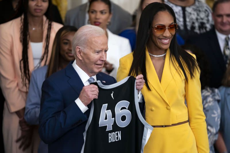 Las Vegas Aces Center A'ja Wilson gives President Joe Biden a jersey during a ceremony celebrating the Las Vegas Aces victory in the 2023 WNBA Finals in the East Room at the White House in Washington on May 9, 2024. File Photo by Bonnie Cash/UPI