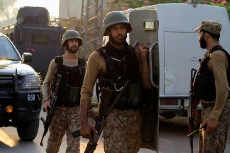 Soldiers return to the staging area after participating in a security operation on the outskirts of Peshawar, Pakistan June 24, 2017. REUTERS/ Fayaz Aziz