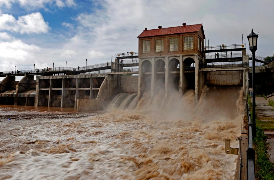 Water flows at the Lake Overholser Dam in Oklahoma City after days of heavy rain in central Oklahoma on May 9, 2015.