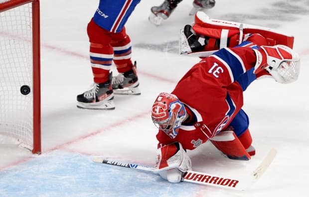 Montreal Canadiens goaltender Carey Price watches the puck go in during Game 4 of the Stanley Cup final against the Tampa Bay Lightning on July 5. (Ryan Remiorz/Canadian Press - image credit)