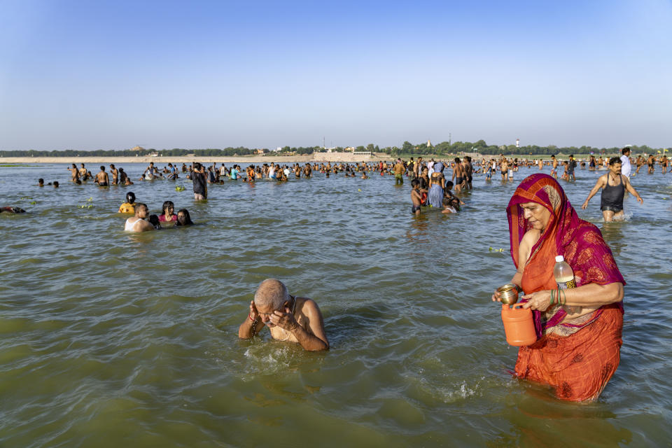 FILE - Hindu devotees bath and perform morning rituals at Sangam, the confluence of the rivers Ganges and Yamuna, during Devshayani Ekadashi, an auspicious day for devotees of Hindu god Vishnu in Prayagraj, Uttar Pradesh state, India, Sunday, July 10, 2022. In Hinduism, fasting is not an obligation, but a voluntary act of spiritual purification. The most commonly observed fast is Ekadashi, which falls on the 11th day of each lunar cycle as the moon waxes and wanes. (AP Photo/Rajesh Kumar Singh, File)