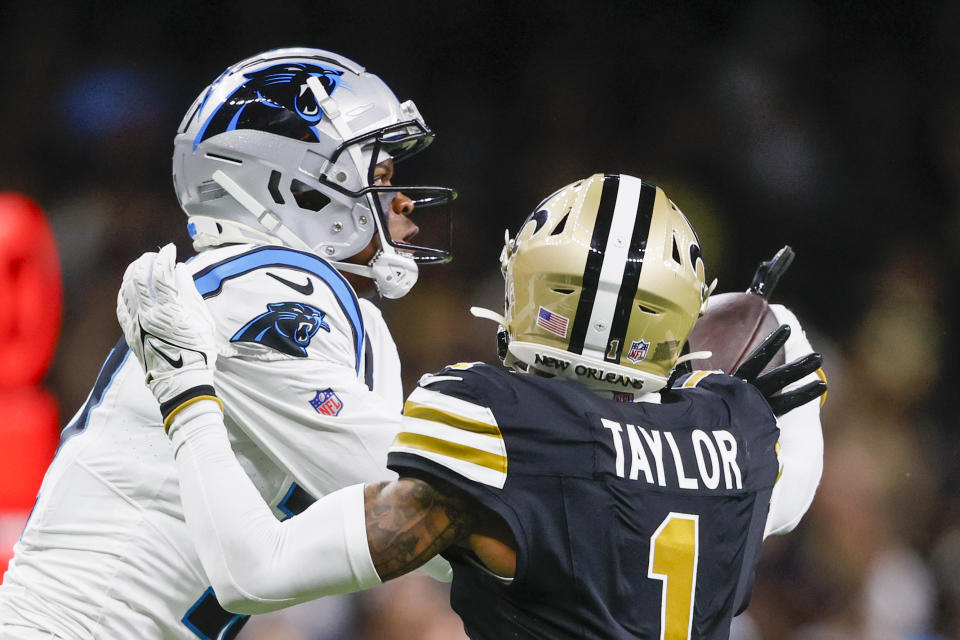 New Orleans Saints cornerback Alontae Taylor breaks up a pass intended for Carolina Panthers wide receiver DJ Chark Jr. during the first half of an NFL football game in New Orleans, Sunday, Dec. 10, 2023. (AP Photo/Butch Dill)