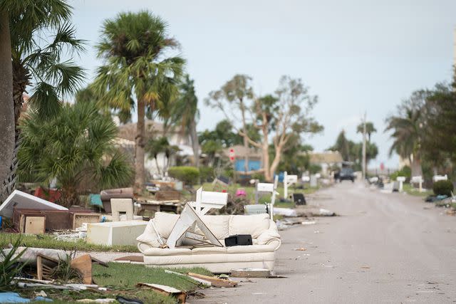 <p>Sean Rayford/Getty</p> Storm debris from Hurricane Helene and Hurricane Milton litters the street in the aftermath of Hurricane Milton on October 10, 2024 in Venice, Florida