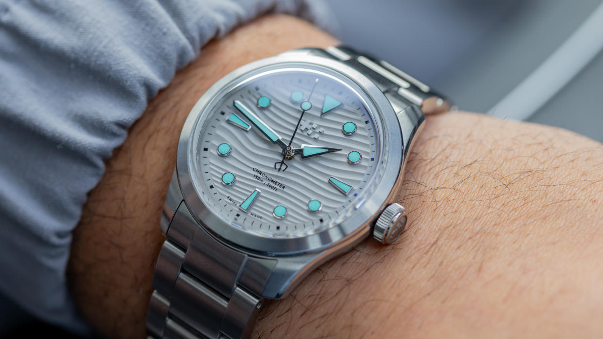  The Oracle Time x Christopher Ward C65 Dune Shoreline worn on a wrist. 