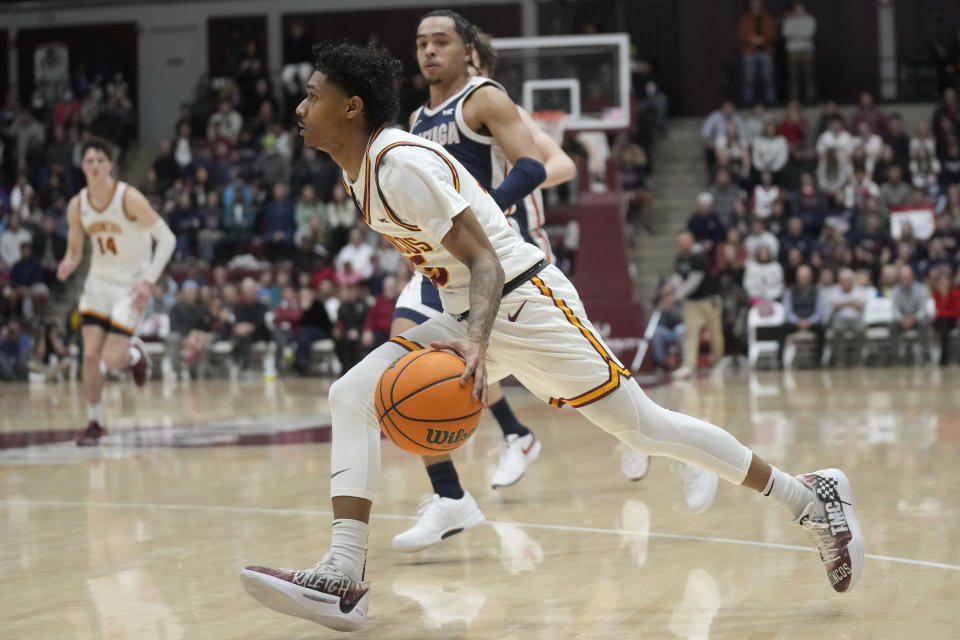 Santa Clara guard Jalen Benjamin, foreground, drives to the basket against Gonzaga guard Ryan Nembhard, back, during the first half of an NCAA college basketball game in Santa Clara, Calif., Thursday, Jan. 11, 2024. (AP Photo/Jeff Chiu)