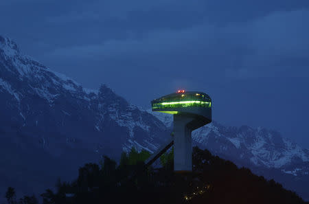 A long time exposure shows the ski jumping hill designed by Iraqi-British architect Zaha Hadid in Innsbruck, Austria March 31, 2016. REUTERS/Dominic Ebenbichler