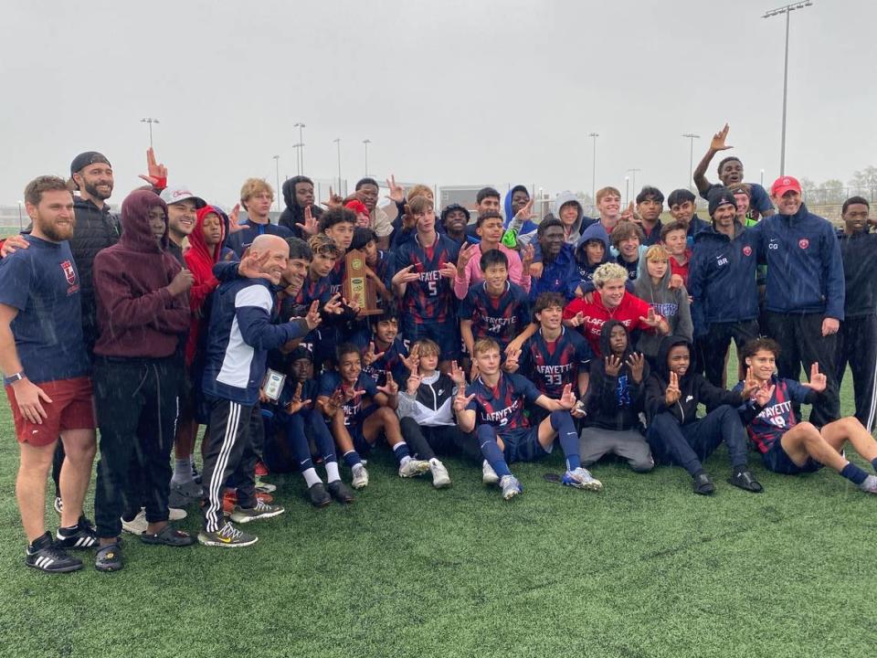 Lafayette’s boys soccer team celebrates winning its first 11th Region championship after a penalty kick shootout was needed to decide Satureay’s finals match against Frederick Douglass.