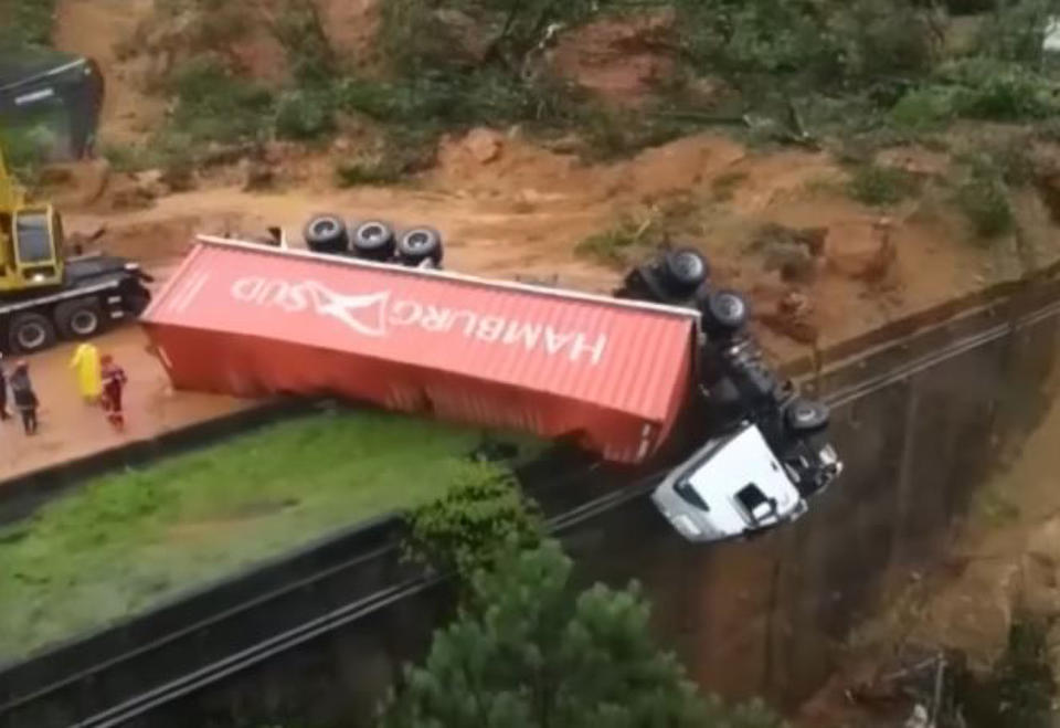 Picture shows Jose's truck hanging off the side of the motorway after the landslide. Source: CEN/Australscope