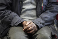 A local resident waits at the Community Food Hub in London, Wednesday, May 4, 2022. Across Britain, food banks and community food hubs that helped struggling families, older people and the homeless during the pandemic are now seeing soaring demand. The cost of food and fuel in the U.K. has risen sharply since late last year, with inflation reaching the highest level in 40 years. (AP Photo/Frank Augstein)