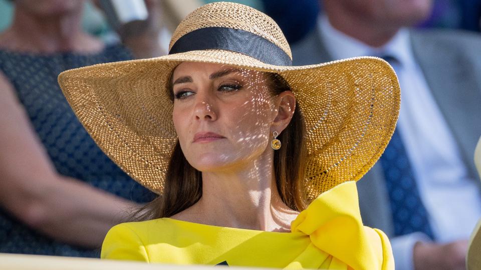 Kate Middleton wearing a straw hat at Wimbledon