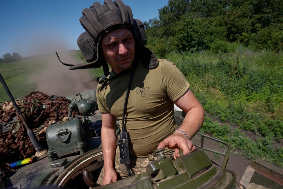 A Ukrainian serviceman of the 30th Kostiantyn Ostrozkyi Separate Mechanized Brigade rides in a T-80 main battle tank (REUTERS)
