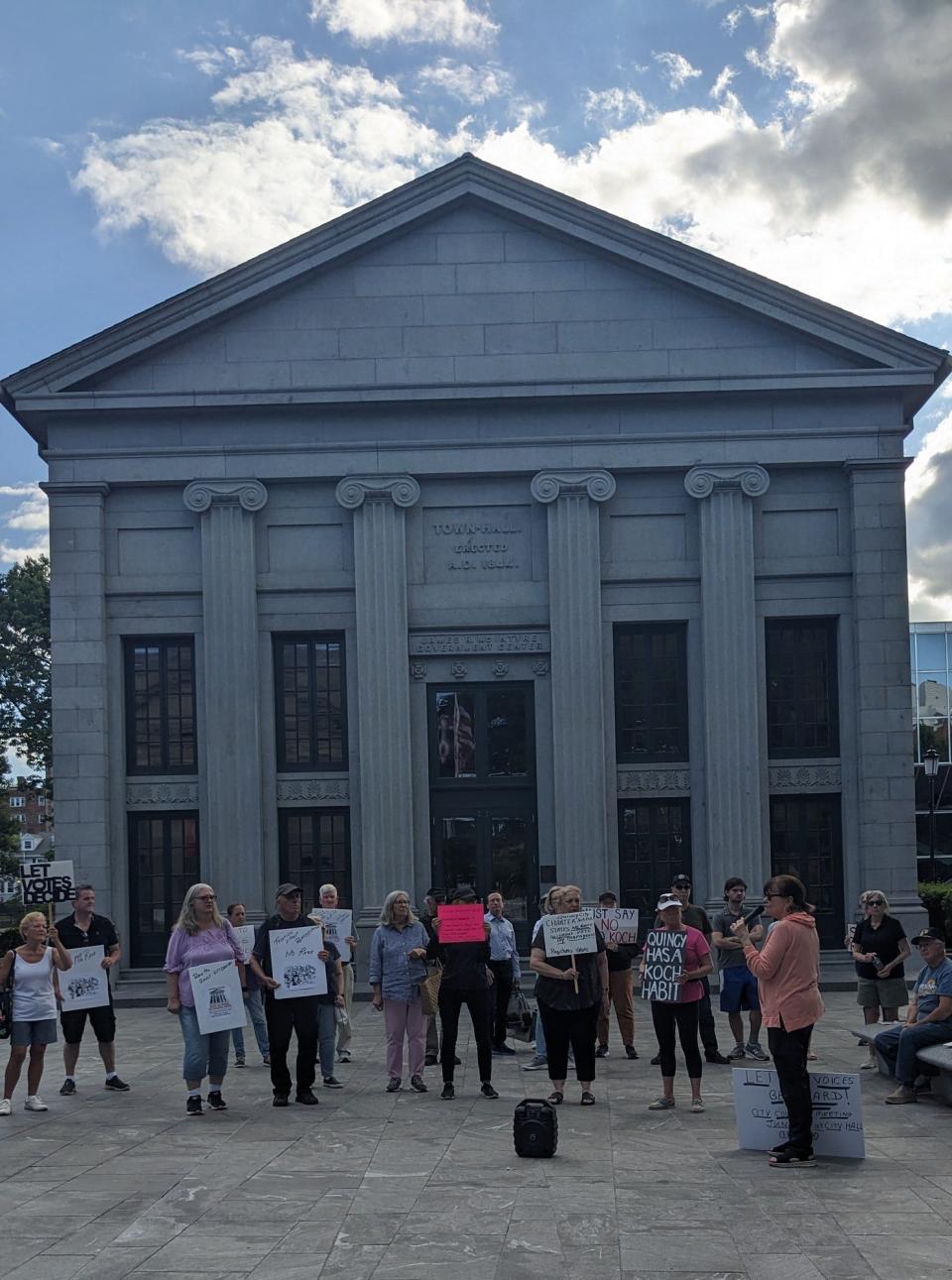 Residents opposed to a 79% pay raise for Quincy Mayor Thomas Koch rally in front of City Hall on Wednesday, May 29, 2024.