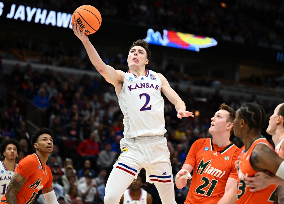 Kansas guard Christian Braun (2) shoots past a Miami defender during the Elite Eight game March 27 in Chicago. Braun's postseason success is part of why he has his opportunity in the NBA.