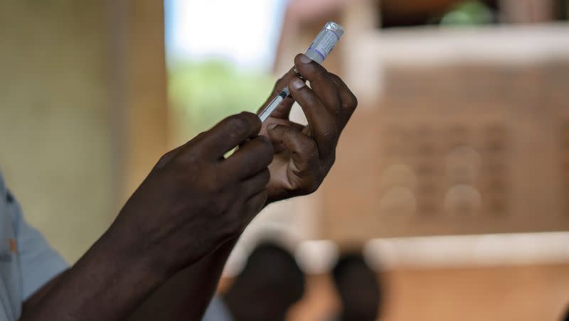 Health officials prepare to administer a vaccine in the Malawi village of Tomali with the world’s first vaccine against malaria in a pilot program in Tomali, Dec. 11, 2019. Cameroon is beginning the world’s first routine immunization program against malaria for children, a move that experts hope will mark the start of a campaign across Africa to dampen the impact of the parasitic disease.