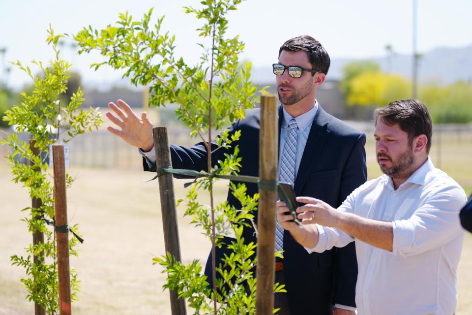 Rep. Ruben Gallego receives a tour of recently planted trees along Baseline Road from David Hondula, director of heat response and mitigation for the city of Phoenix, on April 20, 2022, in Phoenix.