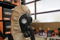 A gas mask and hazmat suit for children is seen in the warehouse of Mira Safety in Austin