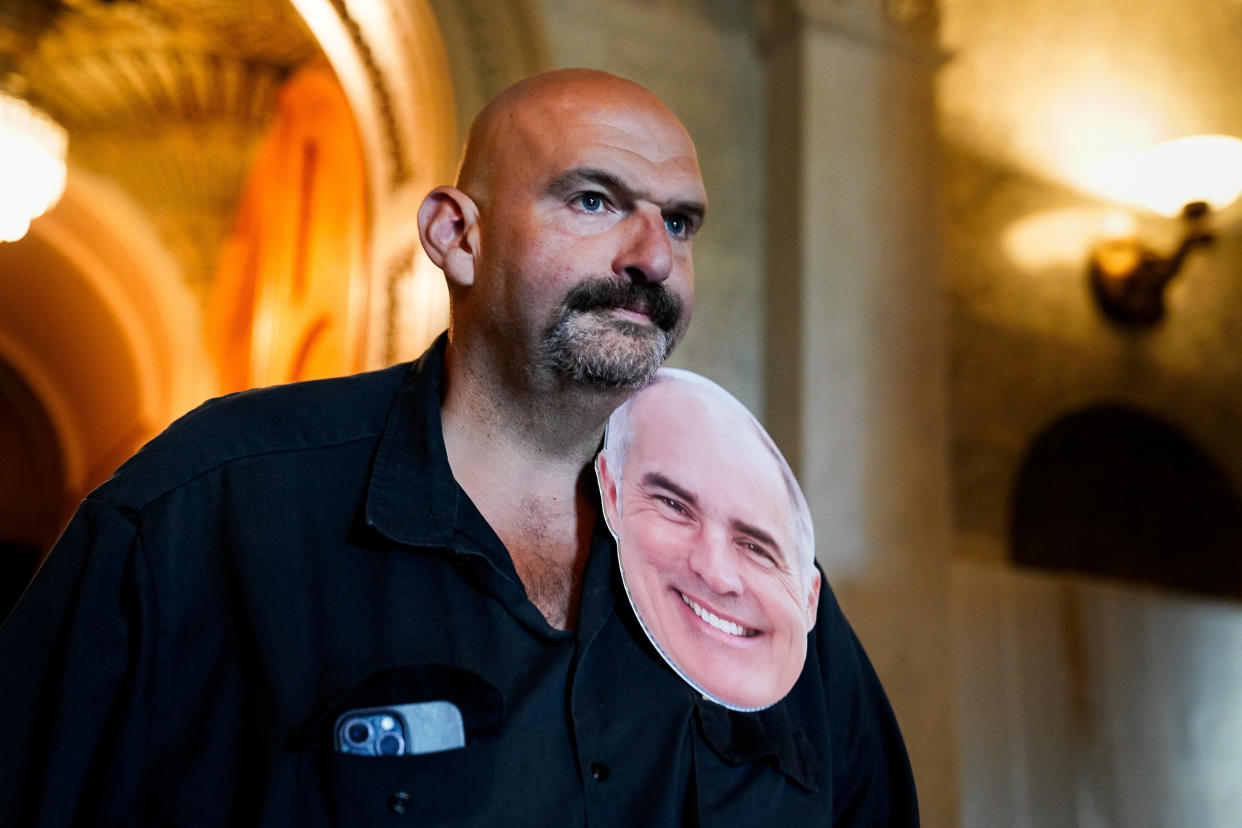 U.S. Senator John Fetterman (D-PA) wears an enlarged cutout of the face of Senator Bob Casey (D-PA) at the U.S. Capitol in Washington, U.S., September 12, 2023. (Elizabeth Frantz/Reuters)