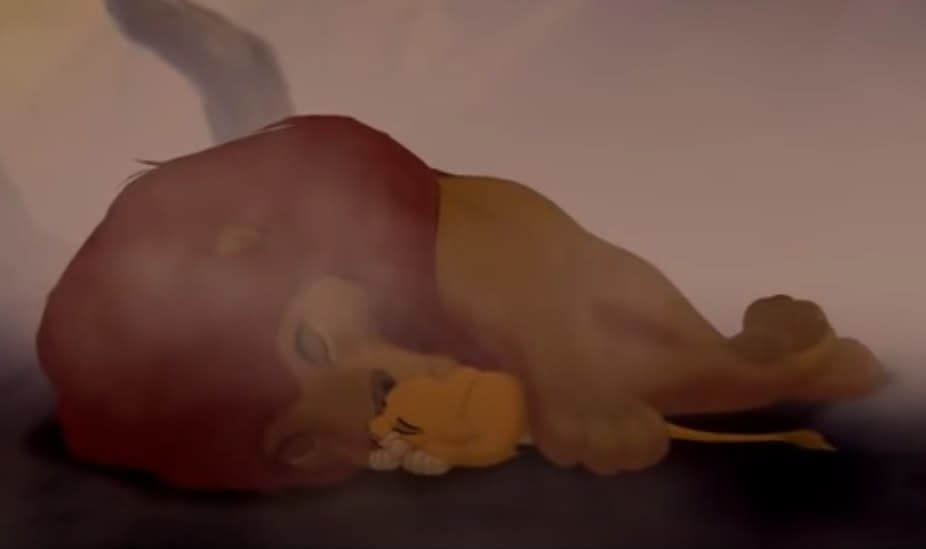 Simba lies next to a dead Mufasa