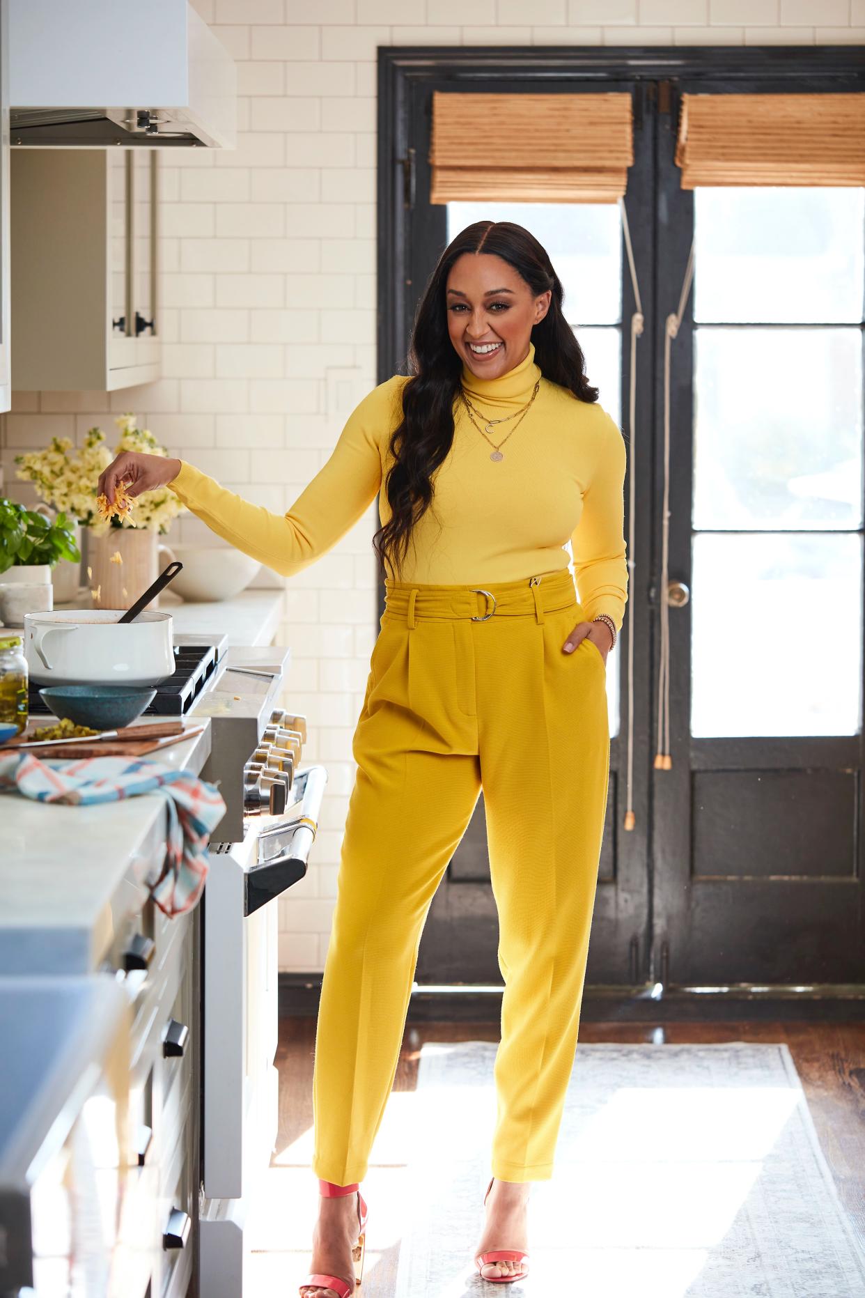 The Quick Fix Kitchen cookbook author just launched her Spice by Tia Mowry cookware collection. (Photo: Felisha Tolentino)