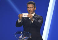 Karl-Heinz Riedle, former soccer player and soccer official, holds the lot of Czech Republic during the draw for the groups to qualify for the 2024 European soccer championship in Frankfurt, Germany, Sunday, Oct.9, 2022. (Arne Dedert/dpa via AP)