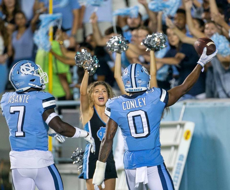 North Carolina’s Ja’Qurious Conley (0) celebrates after an interception of Virginia quarterback Brennan Armstrong in the third quarter on Saturday, September 18, 2021 at Kenan Stadium in Chapel Hill, N.C.