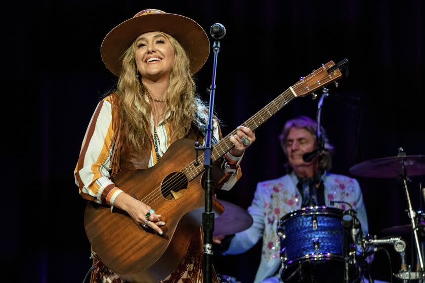 Lainey Wilson, left, and Harry Stinson perform during Marty Stuart's 19th Annual Late Night Jam at the Ryman Auditorium on Wednesday, June 8, 2022 in Nashville, Tenn. (Photo by Amy Harris/Invision/AP)