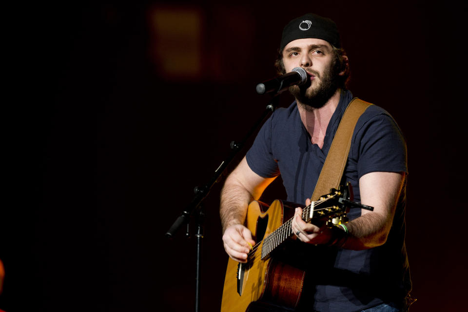 FILE - In this March 2, 2013 file photo, Thomas Rhett opens for Jason Aldean at Madison Square Garden, in New York. Growing up watching his father, Rhett Akins, on tour gave the 23-year-old Thomas Rhett some insight at a young age about how to deal with nerves and crowds. (Photo by Charles Sykes/Invision/AP, File)