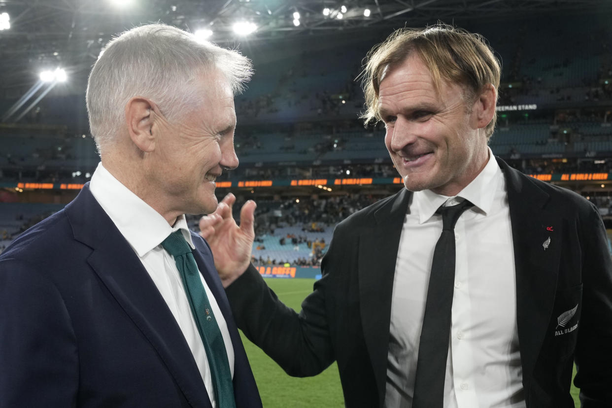 New Zealand's head coach Scott Robertson, right, chats with Australia's head coach Joe Schmidt after New Zealand won their rugby union test match in Sydney, Saturday, Sept. 21, 2024. (AP Photo/Rick Rycroft)