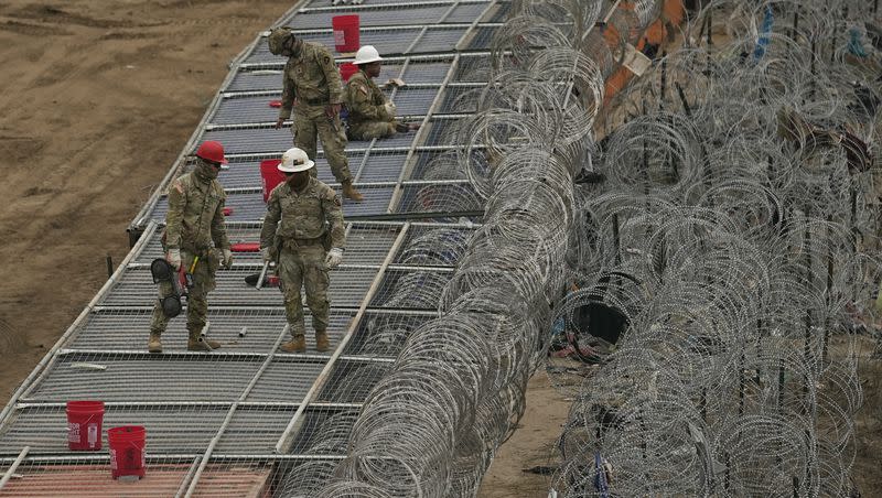 Guardsmen fortify the border along the Rio Grande with concertina wire on Friday, Feb. 2, 2024, in Eagle Pass, Texas. The Texas city has gained an unsolicited spotlight in an extraordinary showdown between the state’s Republican governor and Democratic White House over border security.