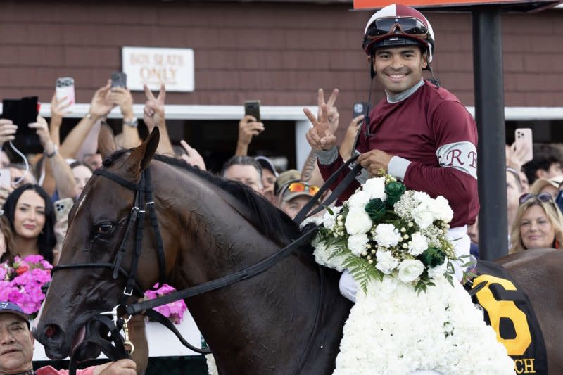 Jockey Luis Suez, aboard Dornoch, smiles in the winners circle after winning the Belmont Stakes at Saratoga Race Course on Saturday in Saratoga Springs, N.Y. Photo by Mark Abraham/UPI