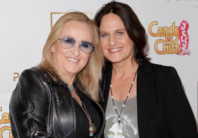 <p>Tibrina Hobson/WireImage</p> Melissa Etheridge and Linda Wallem attend the Primary Wave 10th Annual Pre-Grammy Party on February 14, 2016 in West Hollywood, California.