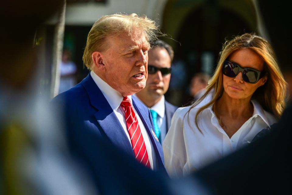 Former US President and Republican presidential candidate Donald Trump (L) and former First Lady Melania Trump arrive to vote in Florida's primary election at a polling station at the Morton and Barbara Mandel Recreation Center in Palm Beach, Florida, on March 19, 2024.