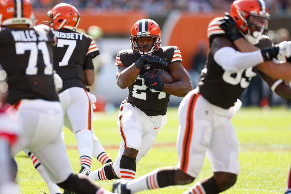 Cleveland Browns running back Nick Chubb runs the ball against the New England Patriots during the first half of an NFL football game, Sunday, Oct. 16, 2022, in Cleveland. (AP Photo/Ron Schwane)