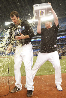 Blue Jays pitcher Brandon Morrow, left, is doused by teammate Jesse Litsch following Morrow's one-hitter