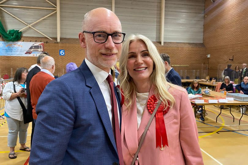 Stephen Kinnock celebrates his victory in the Aberafan Maesteg ward alongside his wife