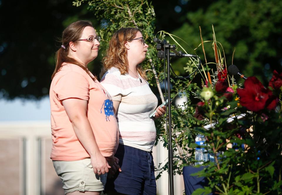 Karen and Jana Moorehouse, sisters of Sarah Schmidt, speak about their sister and her family during a celebration of life service on Tuesday, Aug. 2, 2022, for Tyler and Sarah Schmidt and their 6-year-old daughter, Lula, who were killed in a shooting in the Maquoketa Caves State Park.