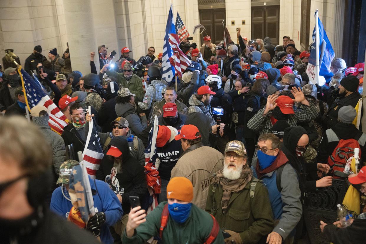 Trump supporters gather near the east front door of the U.S. Capitol after groups breached the building's security on Jan. 6, 2021. (Photo: Win McNamee/Getty Images)