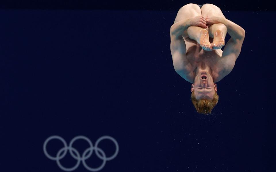 James Heatly seeing the world upside down as he dives in the 3m springboard heats - REUTERS