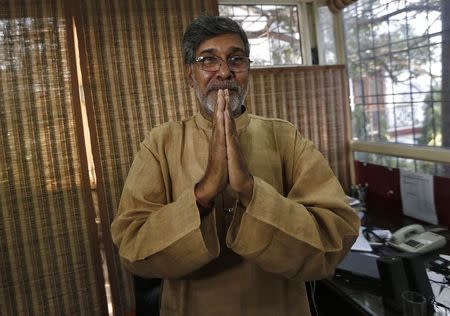 Indian children's right activist Kailash Satyarthi gestures as he speaks with the media at his office in New Delhi October 10, 2014. REUTERS/Adnan Abidi