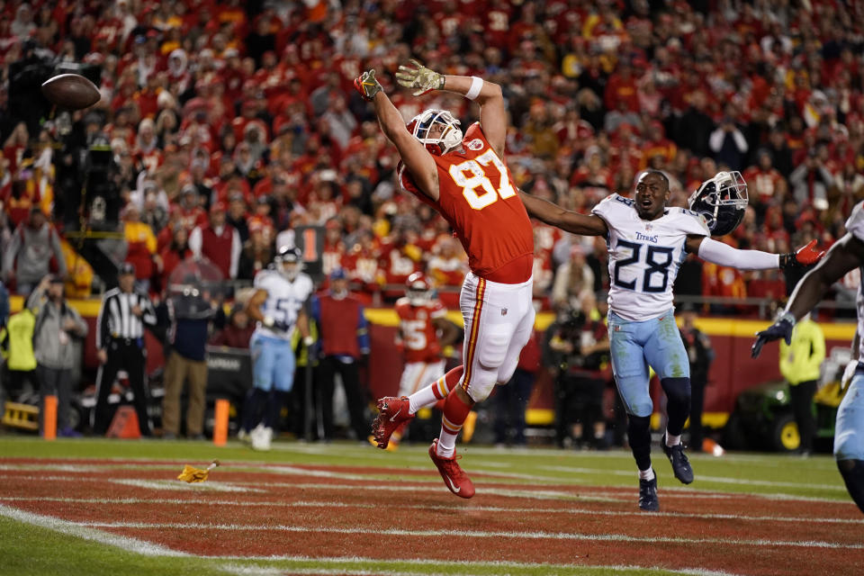 Kansas City Chiefs tight end Travis Kelce (87) is unable to catch a pass on a 2-point conversion try as Tennessee Titans safety Joshua Kalu (28) defends during the second half of an NFL football game Sunday, Nov. 6, 2022, in Kansas City, Mo. A penalty was called against the Titans on the play. (AP Photo/Charlie Riedel)