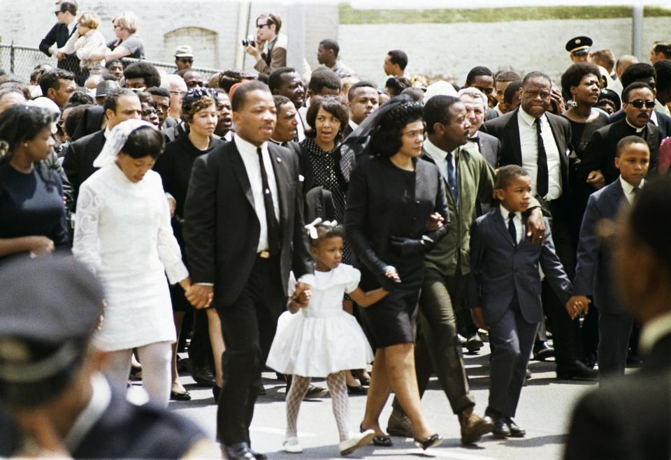 The family of slain civil rights leader Dr. Martin Luther King, Jr., walk in the funeral procession in Atlanta, April 9, 1968. From left: daughter Yolanda, 12; King's brother A.D. King; daughter Bernice, 5; widow Coretta Scott King; Rev. Ralph Abernathy; sons Dexter, 7, and Martin Luther King III, 10.