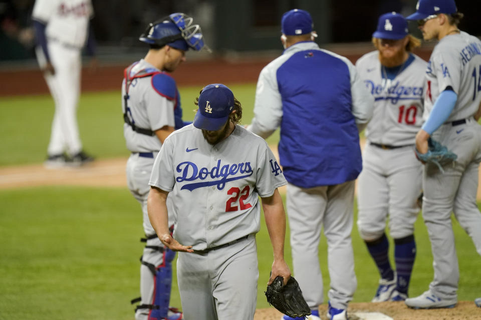 Los Angeles Dodgers starting pitcher Clayton Kershaw (22) leaves the game against the Atlanta Braves during the sixth inning in Game 4 of a baseball National League Championship Series Thursday, Oct. 15, 2020, in Arlington, Texas. (AP Photo/Eric Gay)