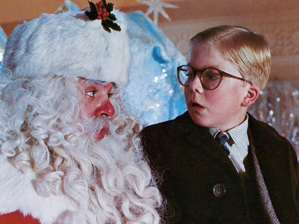 Peter Billingsley sits on Santa's lap in a scene from "A Christmas Story."