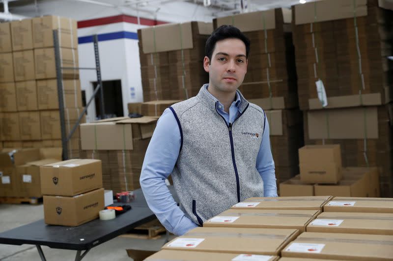 Teddy Haggerty, President of Defender Safety, stands inside his warehouse in Plainview, New York