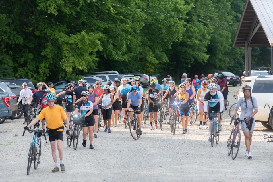 A group of cyclists prepare for a group ride. In addition to Sunday rides, Victory organizes women-only rides Thursday afternoons.