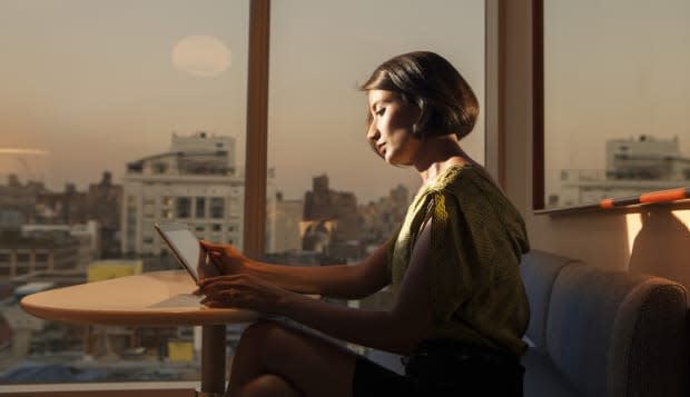 Professional woman working late in city